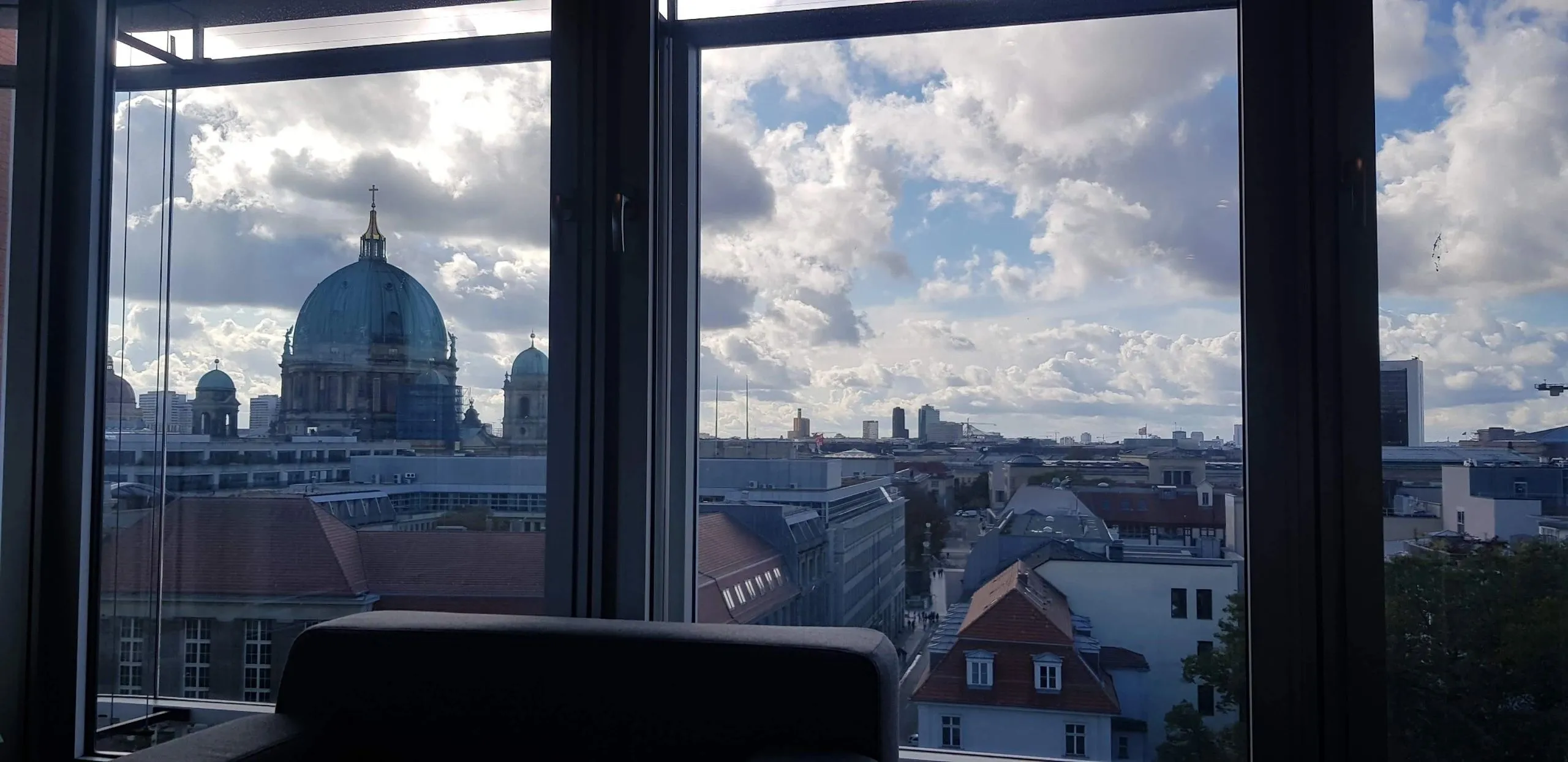 View from a window over Berlin rooftops and the Berlin Cathedral dome