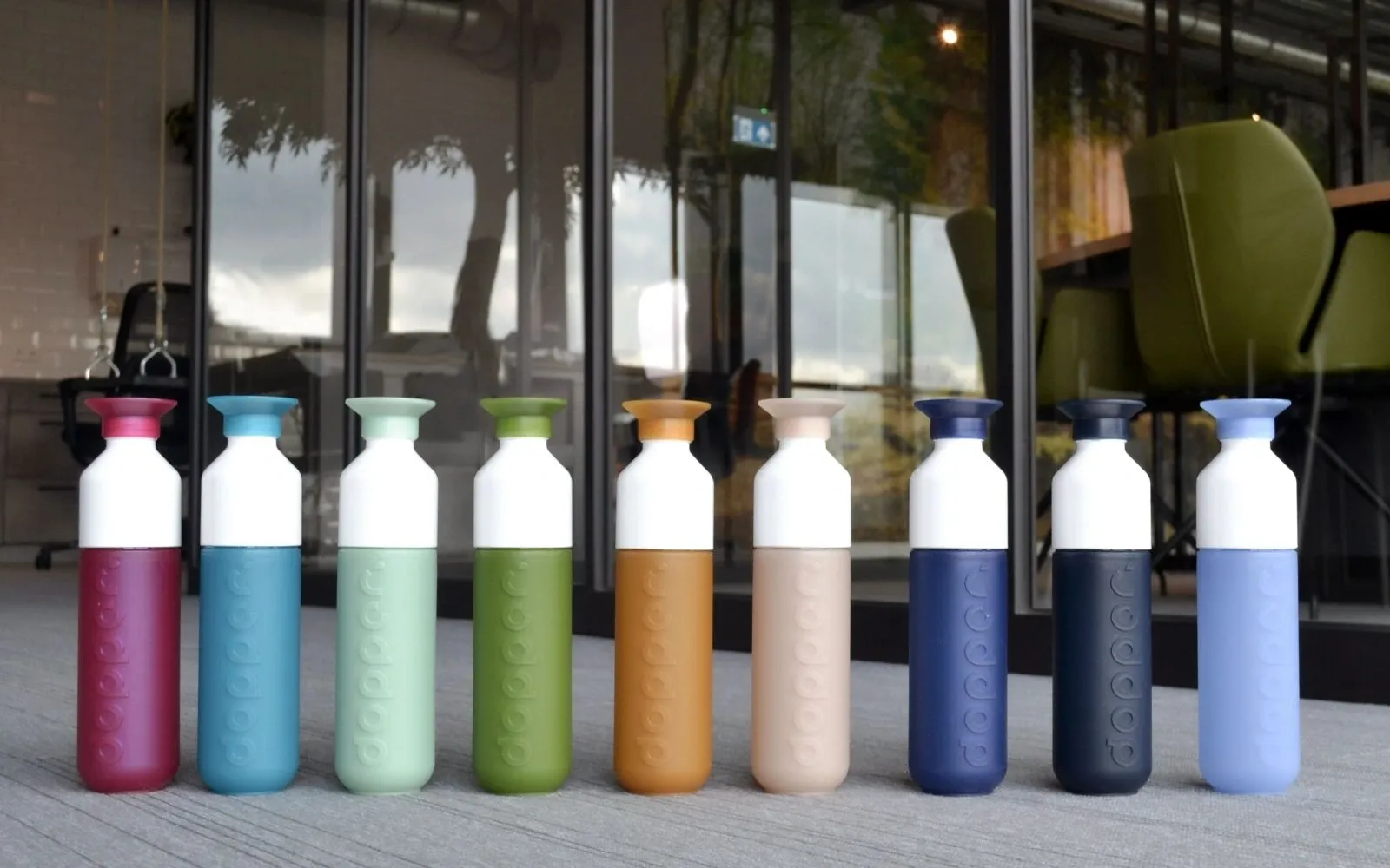 A row of Dopper water bottles in different colours
